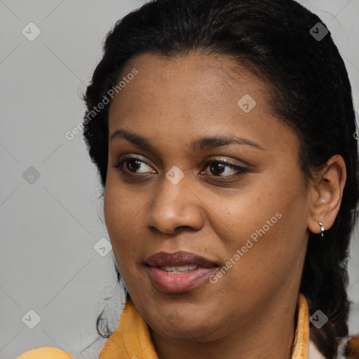 Joyful black young-adult female with medium  brown hair and brown eyes