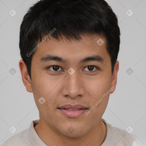 Joyful asian young-adult male with short  brown hair and brown eyes