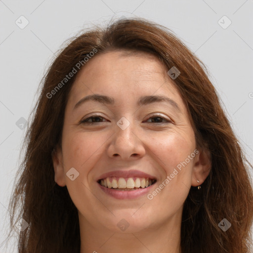 Joyful white adult female with long  brown hair and brown eyes