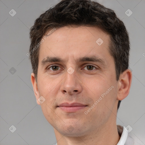 Joyful white adult male with short  brown hair and brown eyes