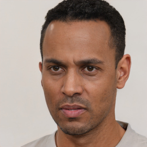 Neutral black young-adult male with short  black hair and brown eyes