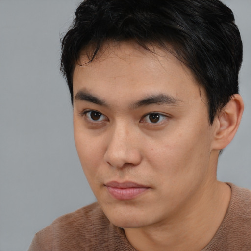 Neutral asian young-adult male with short  brown hair and brown eyes