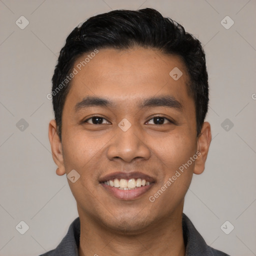 Joyful latino young-adult male with short  black hair and brown eyes