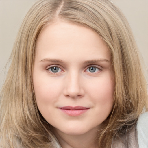 Joyful white young-adult female with long  brown hair and green eyes