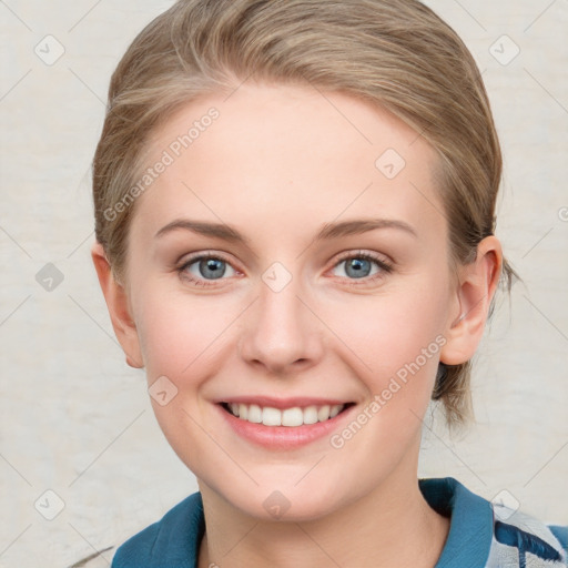 Joyful white young-adult female with medium  brown hair and blue eyes