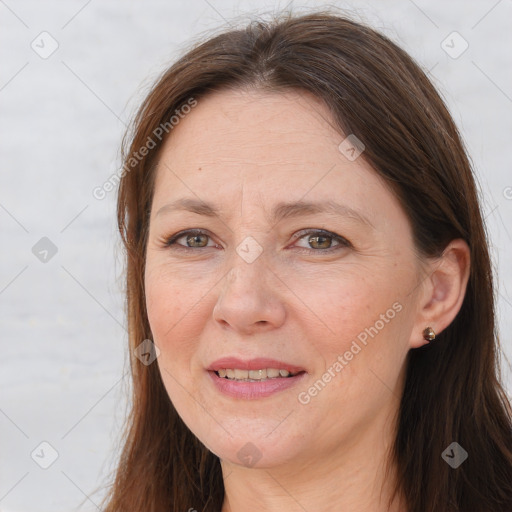 Joyful white adult female with long  brown hair and brown eyes