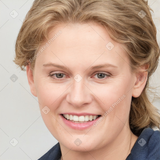 Joyful white young-adult female with medium  brown hair and blue eyes