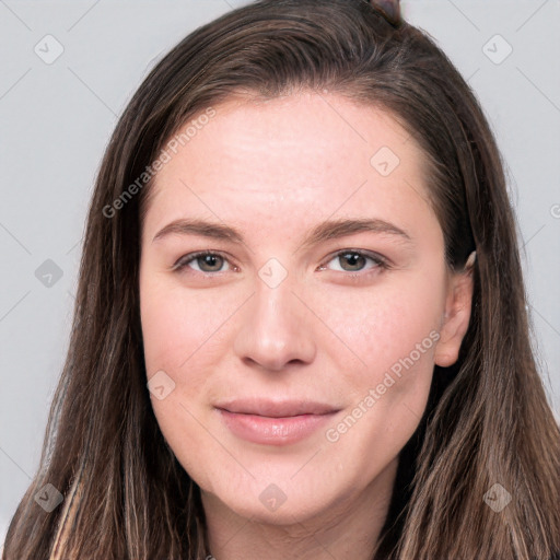 Joyful white young-adult female with long  brown hair and grey eyes