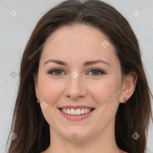 Joyful white young-adult female with long  brown hair and grey eyes