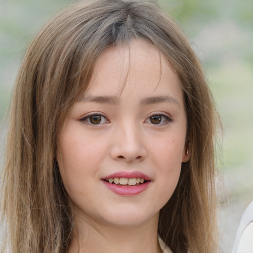 Joyful white child female with long  brown hair and brown eyes