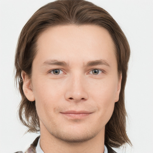 Joyful white young-adult male with medium  brown hair and brown eyes