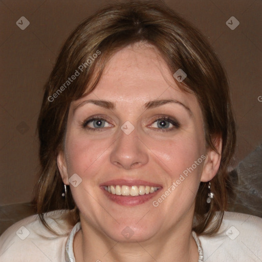 Joyful white adult female with medium  brown hair and blue eyes