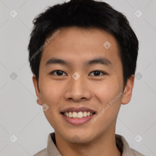 Joyful asian young-adult male with short  brown hair and brown eyes