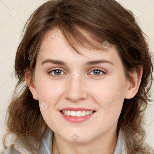 Joyful white young-adult female with medium  brown hair and blue eyes