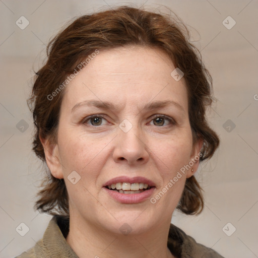 Joyful white adult female with medium  brown hair and grey eyes