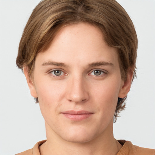 Joyful white young-adult female with short  brown hair and grey eyes