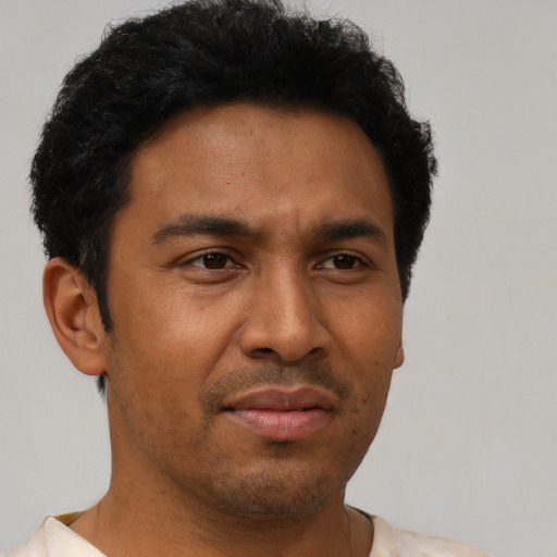 Neutral latino young-adult male with short  brown hair and brown eyes