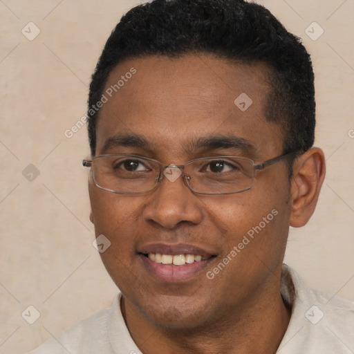 Joyful black young-adult male with short  black hair and brown eyes