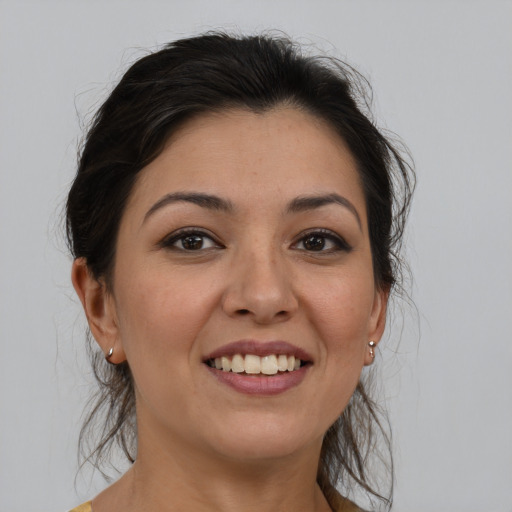 Joyful white young-adult female with medium  brown hair and brown eyes