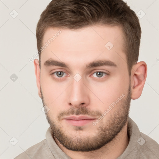 Neutral white young-adult male with short  brown hair and brown eyes