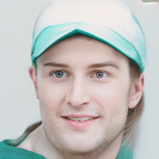 Joyful white young-adult male with short  brown hair and blue eyes