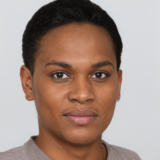 Joyful black young-adult female with short  black hair and brown eyes
