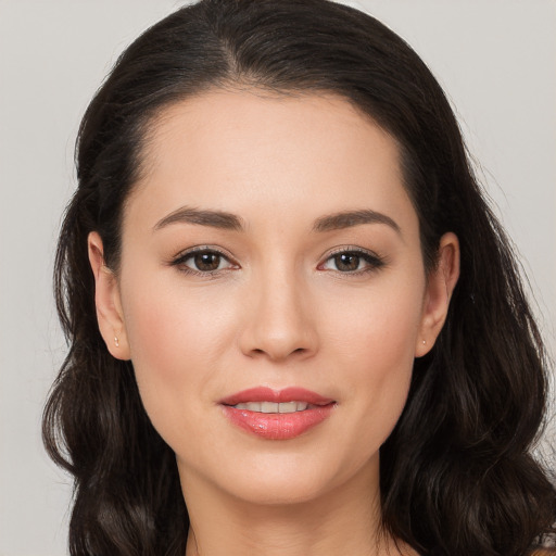 Joyful white young-adult female with long  brown hair and brown eyes