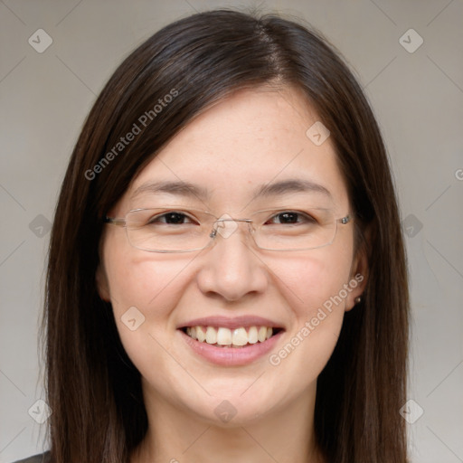 Joyful white young-adult female with long  brown hair and brown eyes