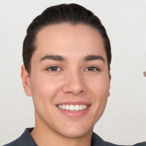 Joyful white young-adult male with short  black hair and brown eyes