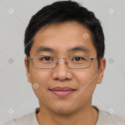 Joyful asian young-adult male with short  brown hair and brown eyes