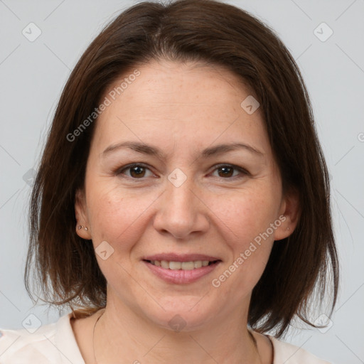 Joyful white adult female with medium  brown hair and brown eyes