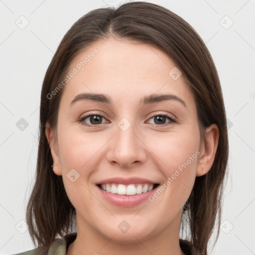 Joyful white young-adult female with medium  brown hair and grey eyes