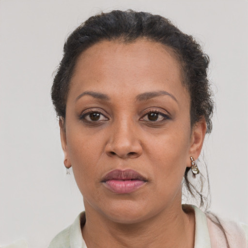 Neutral black adult female with short  brown hair and brown eyes