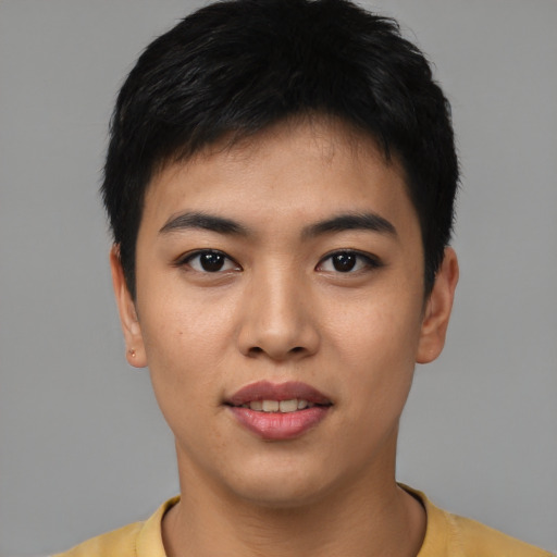 Joyful asian young-adult male with short  black hair and brown eyes