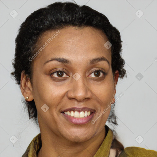 Joyful black adult female with short  brown hair and brown eyes