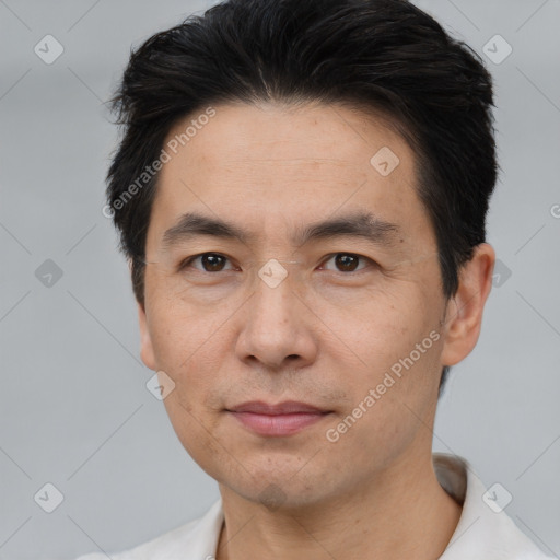 Joyful white adult male with short  black hair and brown eyes