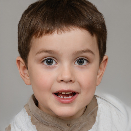 Joyful white child male with short  brown hair and grey eyes