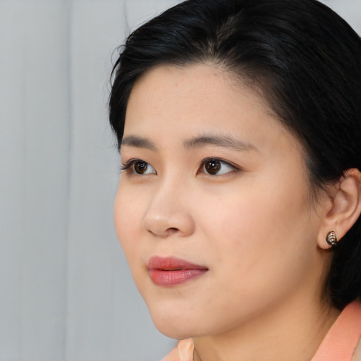 Neutral asian young-adult female with medium  black hair and brown eyes