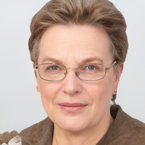 Joyful white middle-aged female with short  brown hair and grey eyes