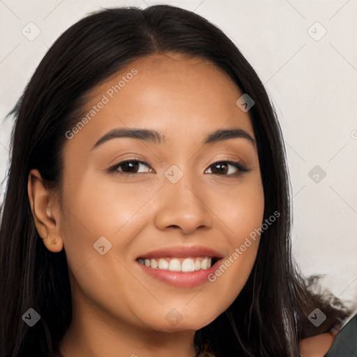 Joyful latino young-adult female with long  black hair and brown eyes