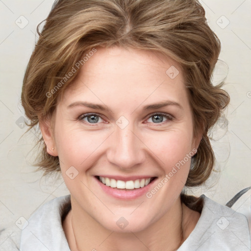 Joyful white young-adult female with medium  brown hair and blue eyes