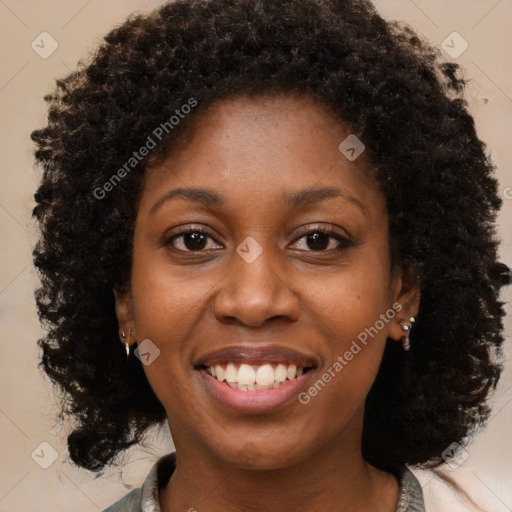 Joyful black young-adult female with medium  brown hair and brown eyes