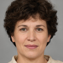 Joyful white adult female with short  brown hair and brown eyes