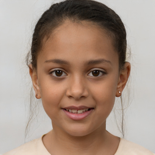 Joyful white child female with short  brown hair and brown eyes