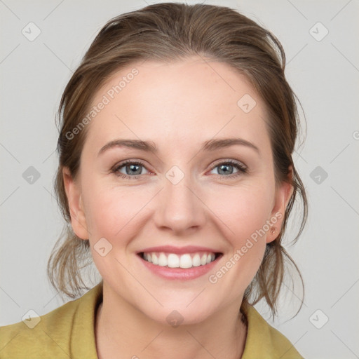 Joyful white young-adult female with medium  brown hair and blue eyes