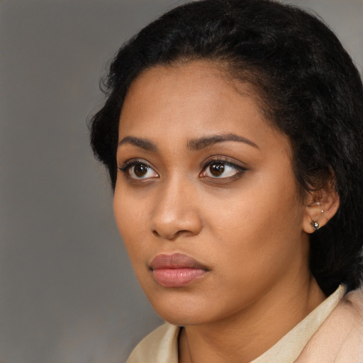Neutral latino young-adult female with medium  black hair and brown eyes