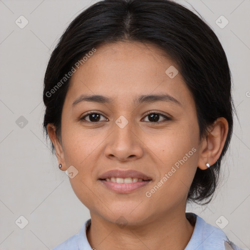 Joyful latino young-adult female with medium  brown hair and brown eyes