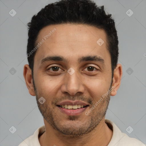 Joyful white young-adult male with short  black hair and brown eyes