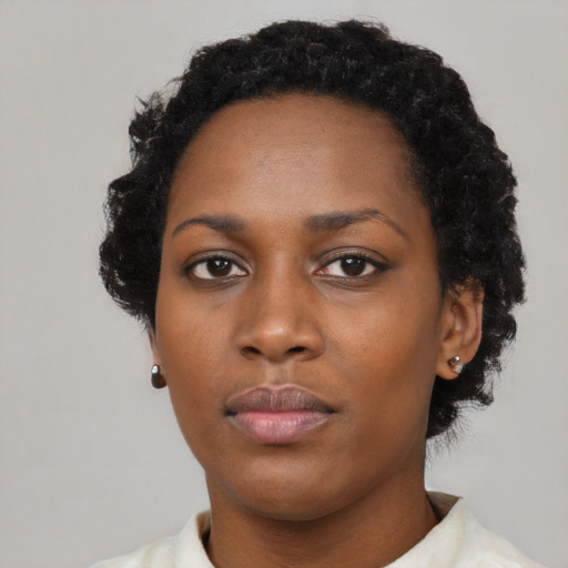 Neutral black young-adult female with short  black hair and brown eyes