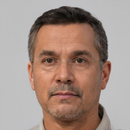 Neutral white middle-aged male with short  brown hair and brown eyes